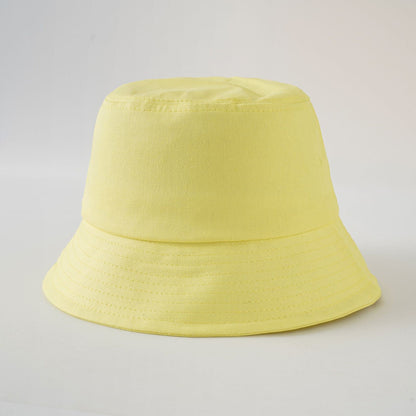 Yellow bucket fisherman hat with wide brim and stitched side panels