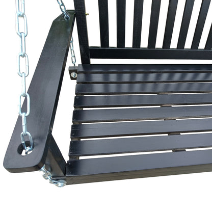 Black wood bench swing with slatted seat, armrests, and chain suspension.