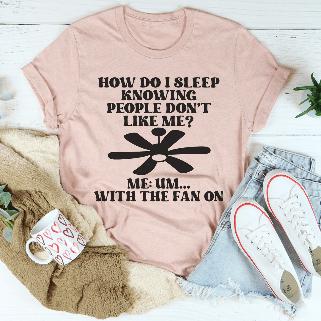 Peach crewneck T-shirt with fan graphic and stacked text, short sleeves