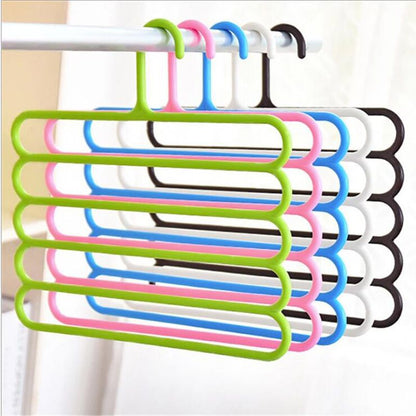 Close-up of multicolor 5-layer plastic hangers with five rounded bars each.
