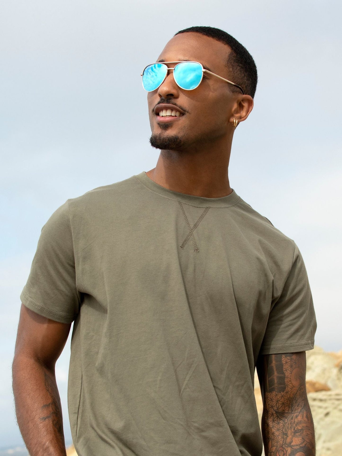 Polarized sunglasses with blue mirrored lenses and dark frames, worn