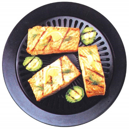 Round smokeless grill with grilled bread slices and zucchini on black grates