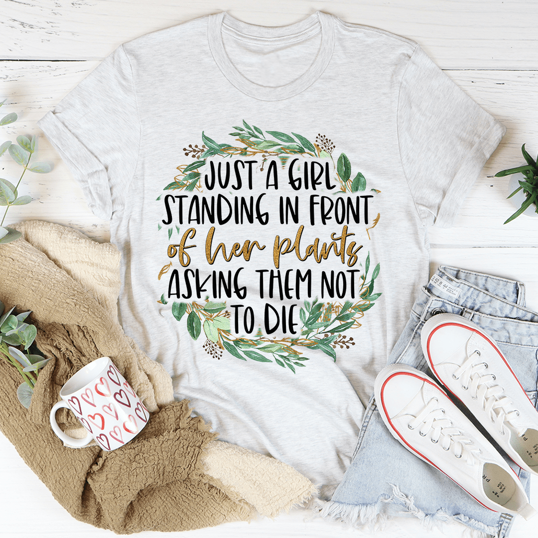 Light gray graphic T-shirt with floral wreath text reading “Just a girl...”