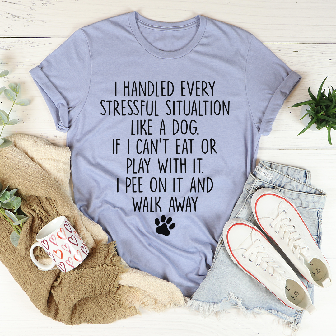 Light blue crewneck short-sleeve T-shirt with a dog paw and quote graphic in black.