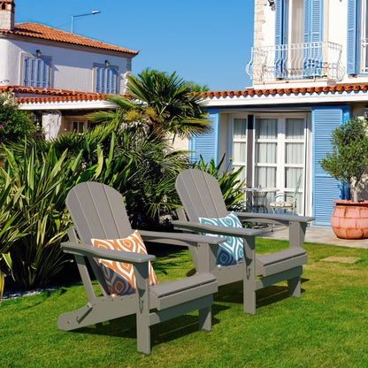 Pair of folding Adirondack-style patio chairs with slatted backs and seats on lawn.