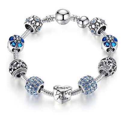 Blue flower charm bracelet with silver-tone beads and heart Love charm.