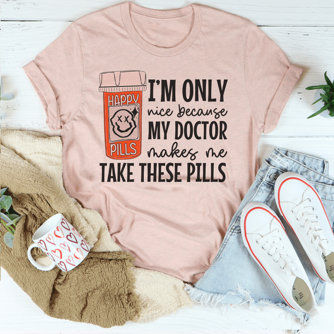 Peach Happy Pills graphic T-shirt with pill-themed “I’m only nice because my doctor” print