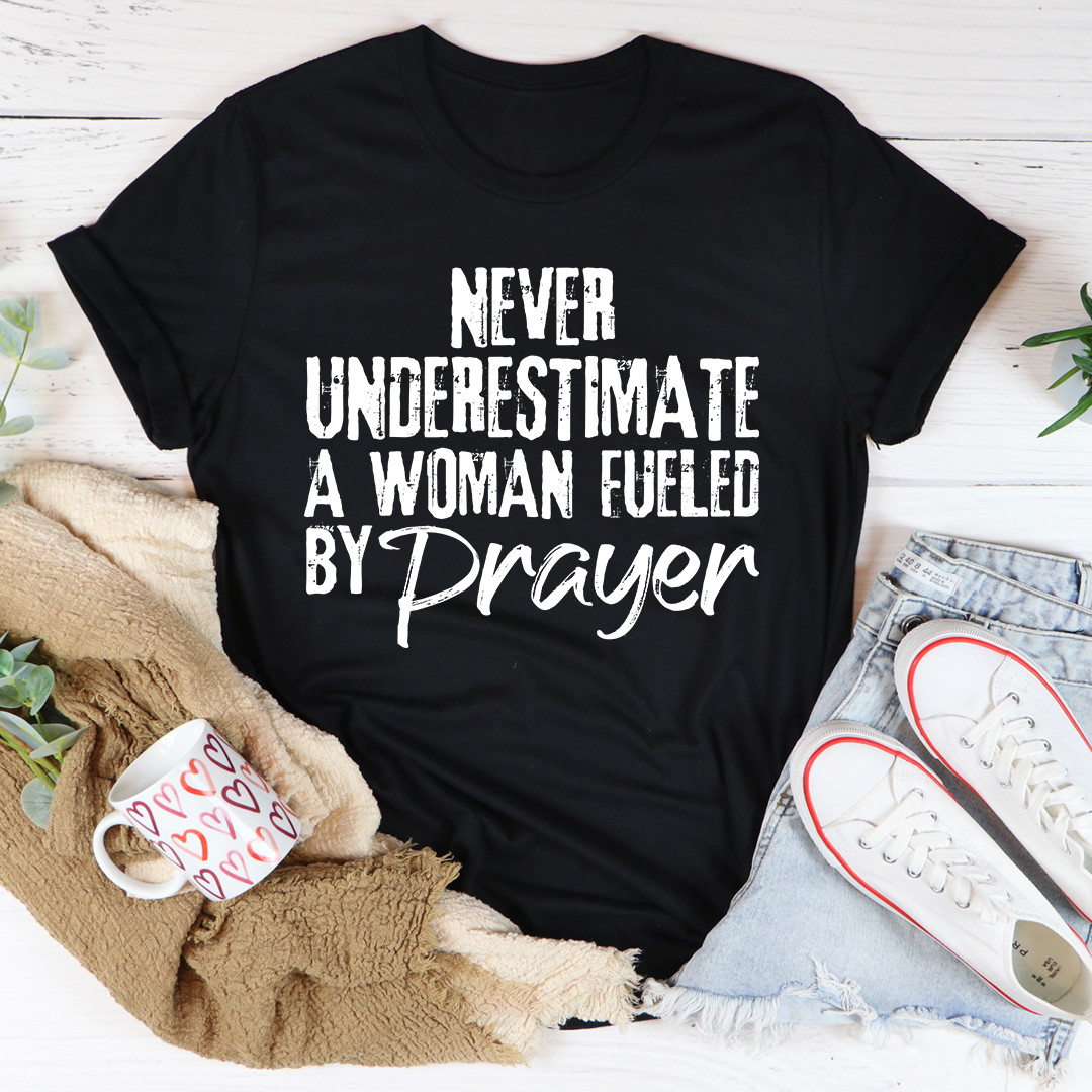Black T-shirt with 'Never Underestimate a Woman Fueled by Prayer' front graphic