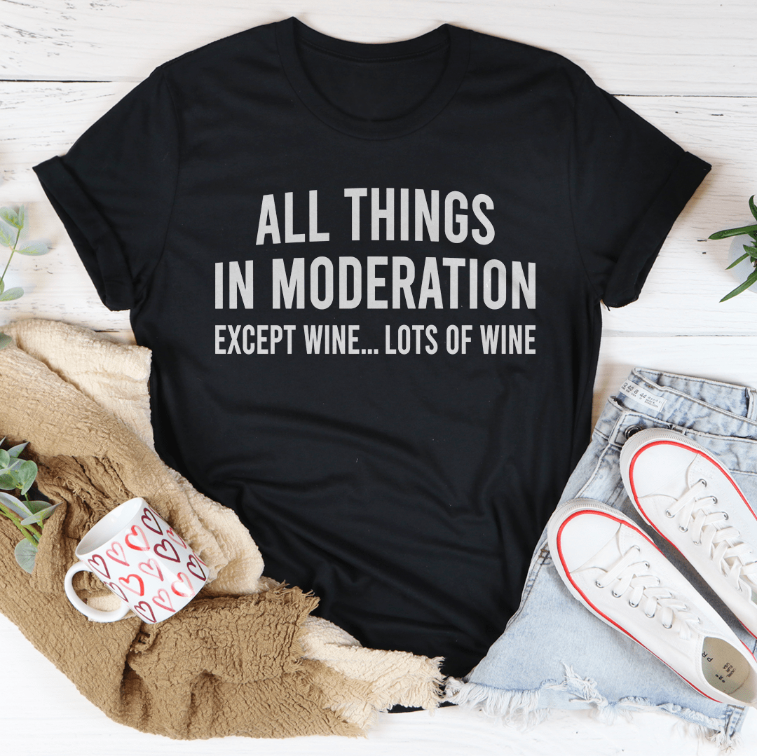 Black crewneck T-shirt with white text: "ALL THINGS IN MODERATION" and "EXCEPT WINE"