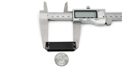 Mini USB audio microphone recorder, black, shown with measuring calipers
