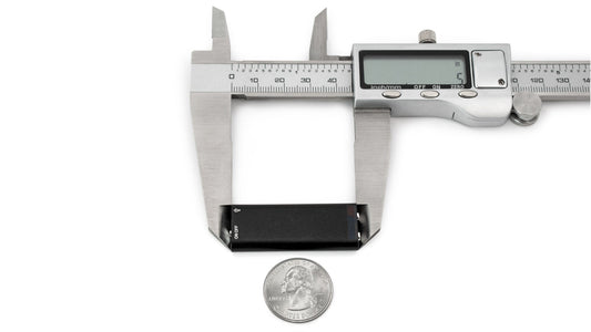 Mini USB audio microphone recorder, black, shown with measuring calipers