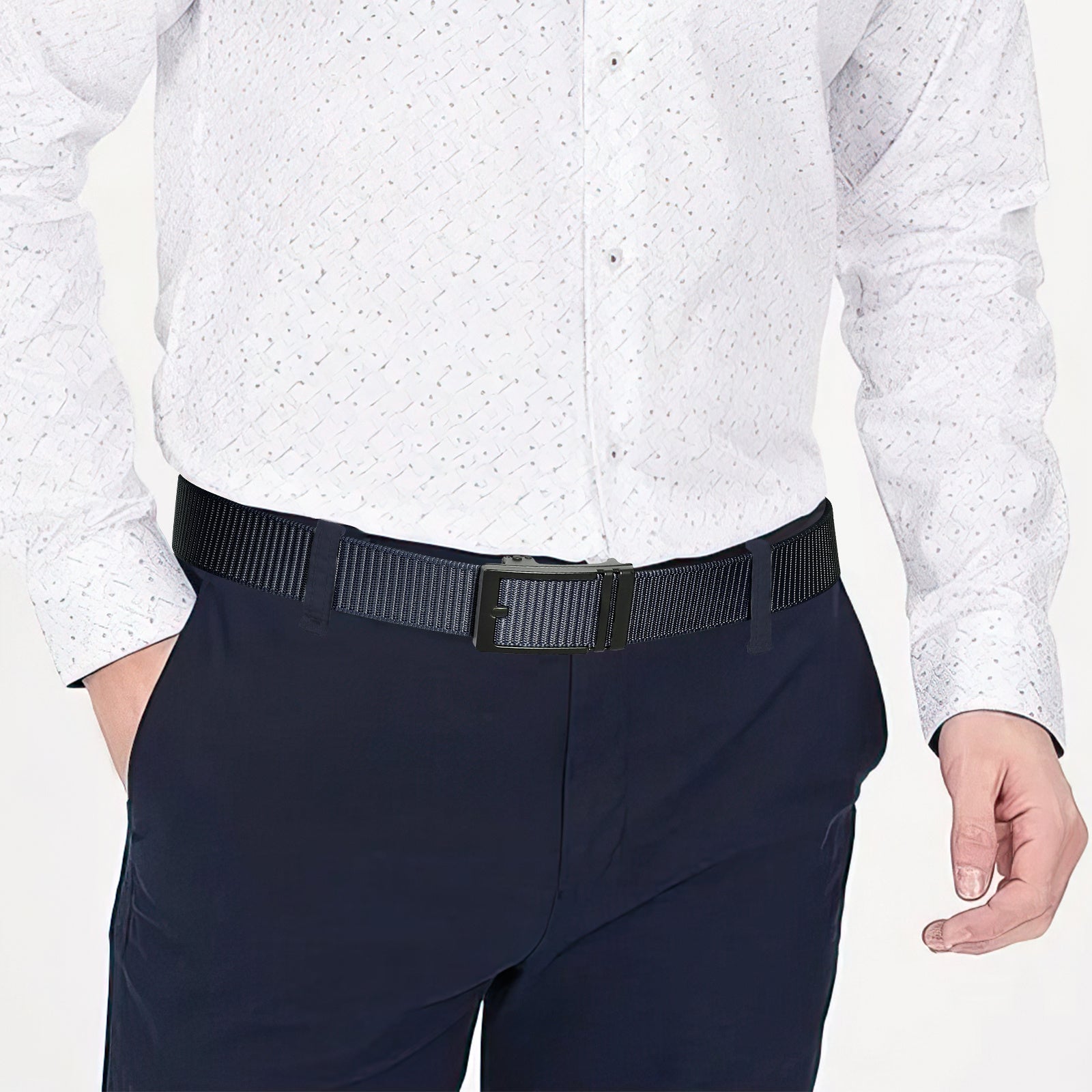 Navy nylon ratchet belt on dark pants with black automatic sliding buckle