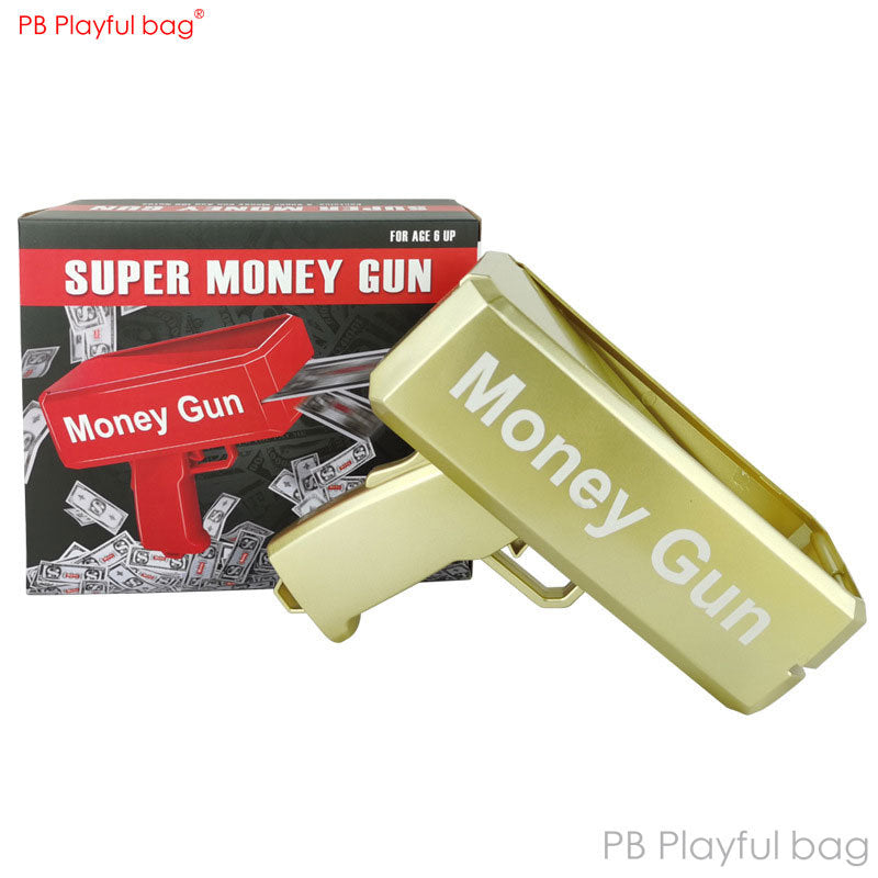 Gold and red plastic money gun toy in box, with “Super Money Gun” text