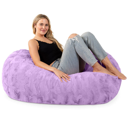 Purple faux fur 4-foot bean bag couch; woman lounges with legs up