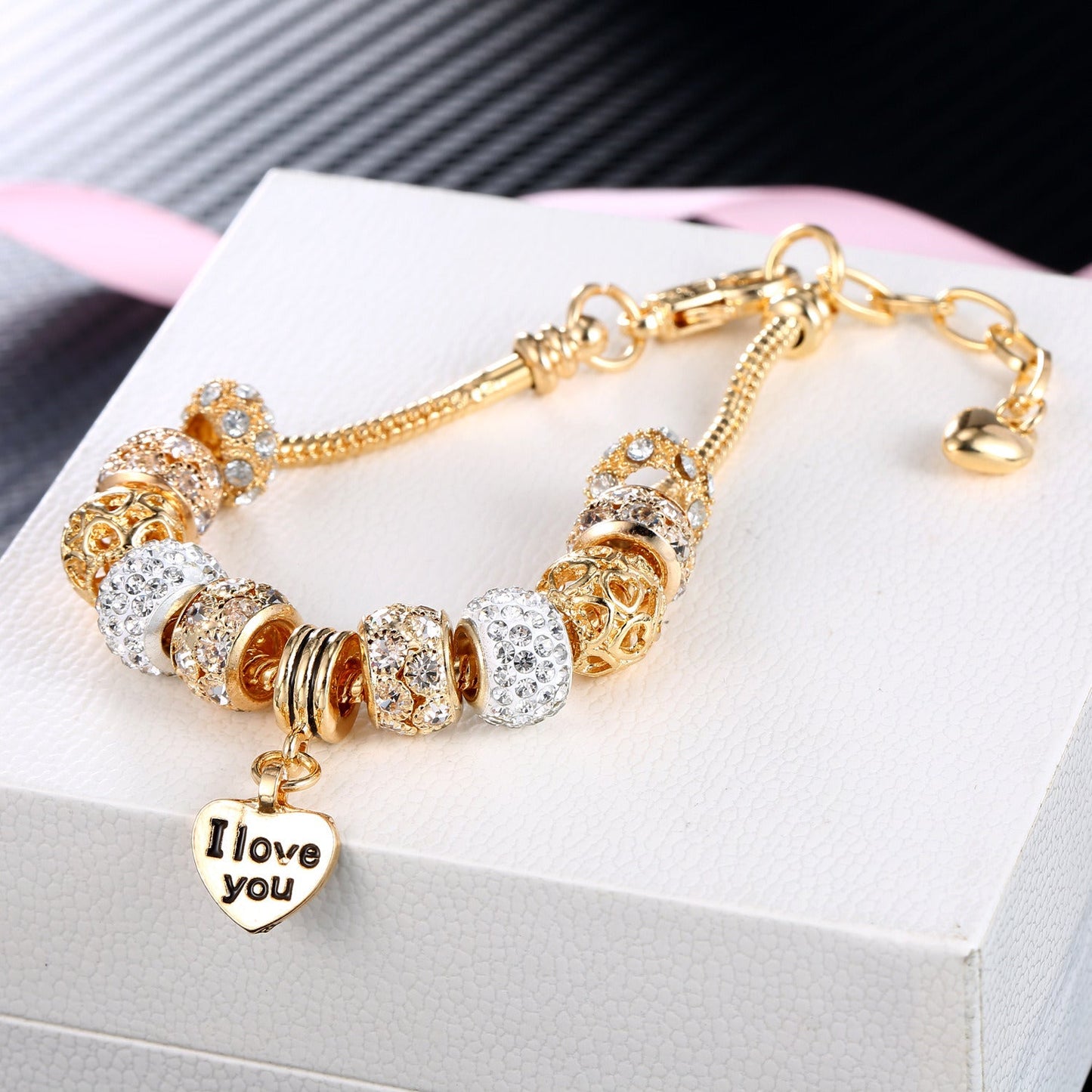 Gold plated heart charm bracelet with crystal beads and linked extender chain