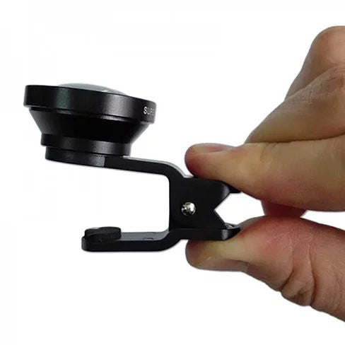 Black super wide 0.4x clip-on smartphone lens being installed by hand