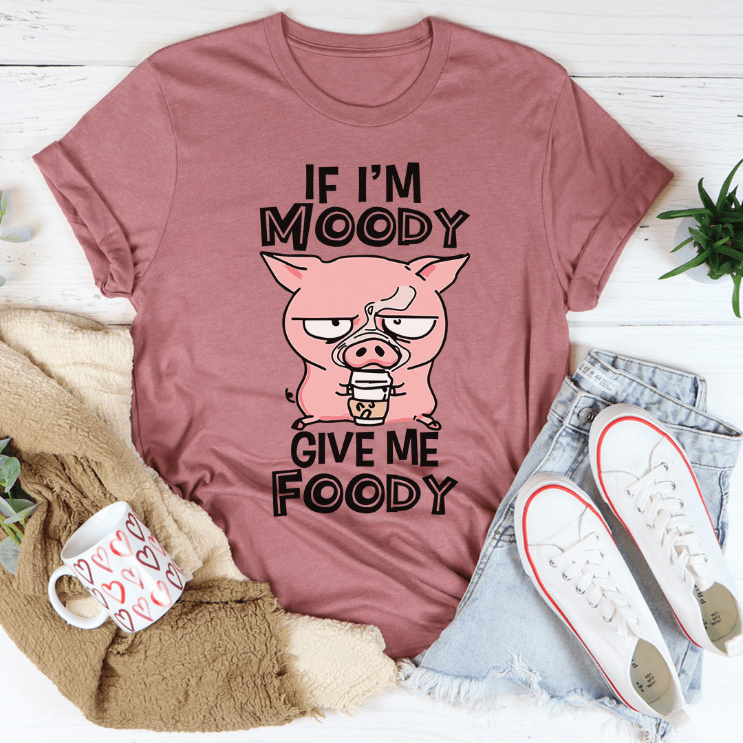 Mauve pink T-shirt showing a pig face cartoon and the text "IF I'M MOODY" "GIVE ME FOODY"