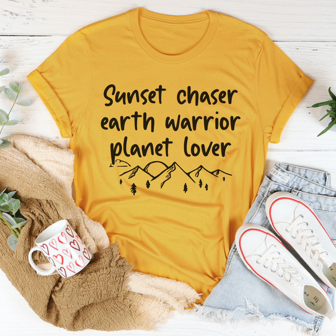 Mustard crewneck T-shirt with 'Sunset chaser earth warrior planet lover' graphic and trees