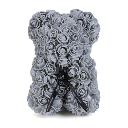 Gray rose teddy bear with black bow ribbon and small heart tags