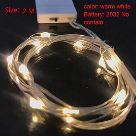 Warm white LED string lights, coiled wire with glowing bulbs