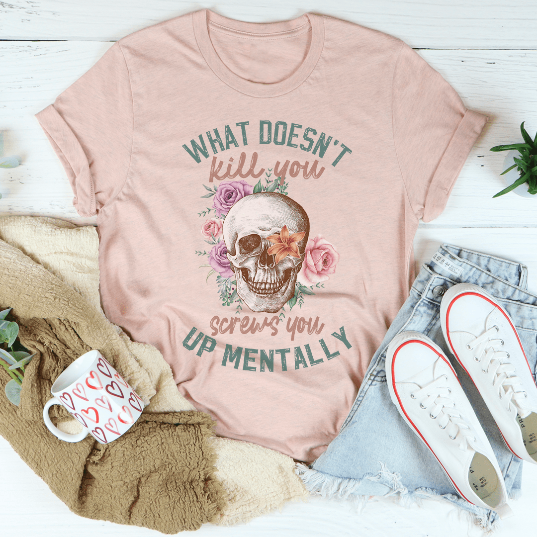 Graphic skull T-shirt, dusty peach, slogan and roses over skull graphic