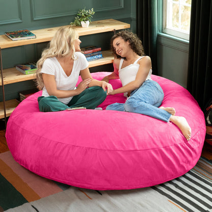 Fuchsia microsuede cocoon bean bag chair with wide seat supporting two people