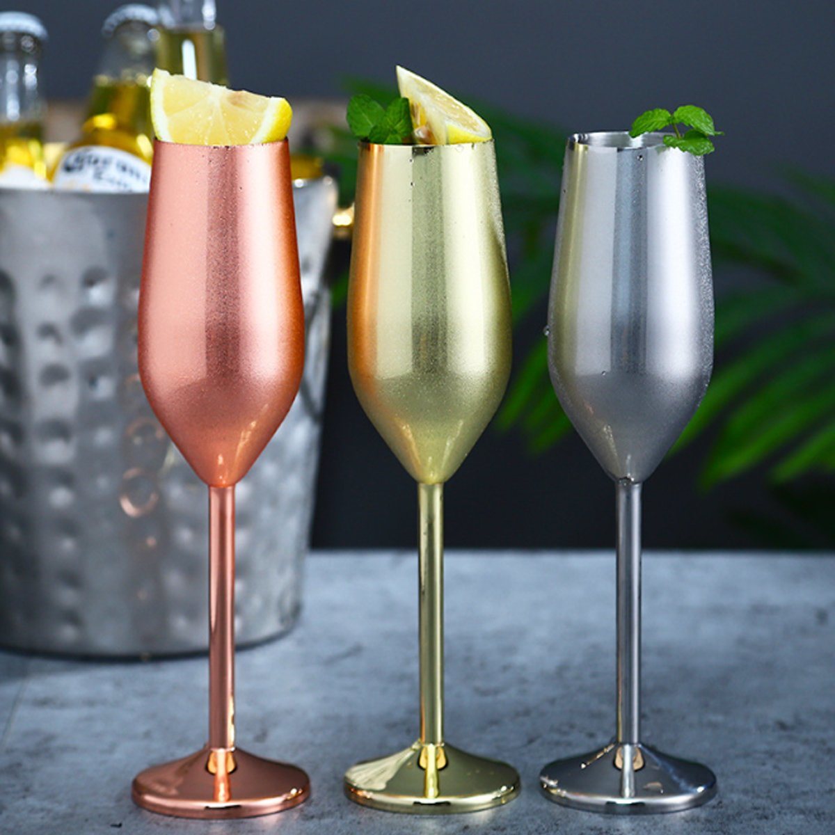 Set of metallic stemmed cocktail glasses in rose gold, gold, and silver
