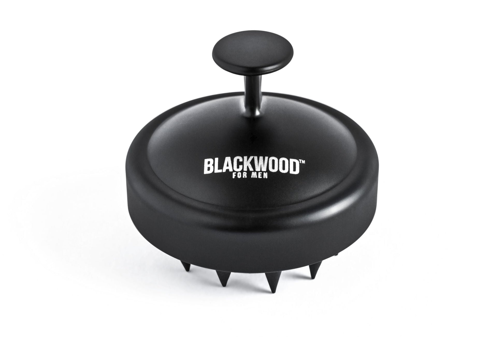 Black scalp massager with BLACKWOOD logo on domed head