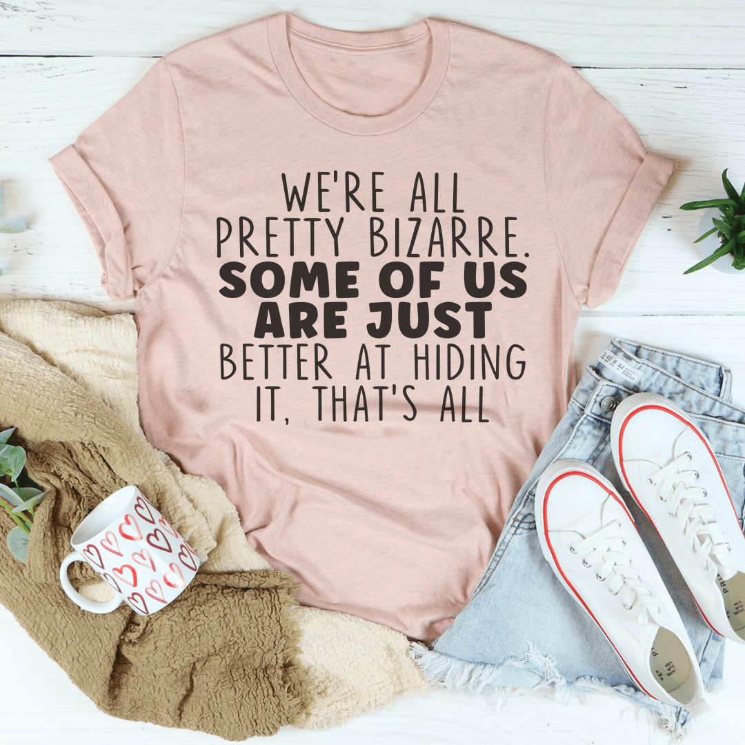 Mauve short-sleeve crewneck T-shirt with centered bold quote text, “pretty bizarre”.