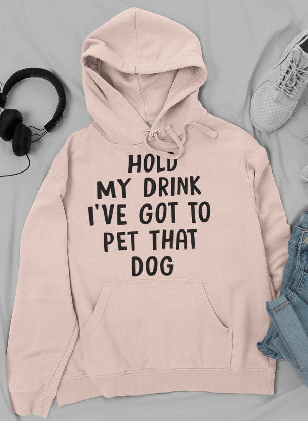 Light pink hoodie with front pocket and drawstring; “PET THAT DOG” slogan print.