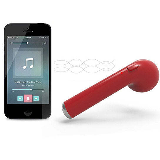 Red Bluetooth earbud beside a smartphone showing music playback