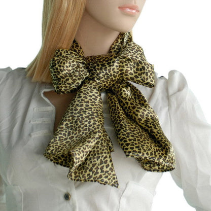 Leopard print silk scarf tied at the neck, olive and tan soft natural fabric