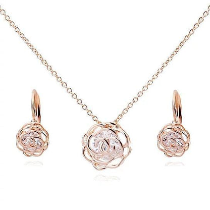 Rose gold rose pendant necklace with matching rose earrings and CZ-like center