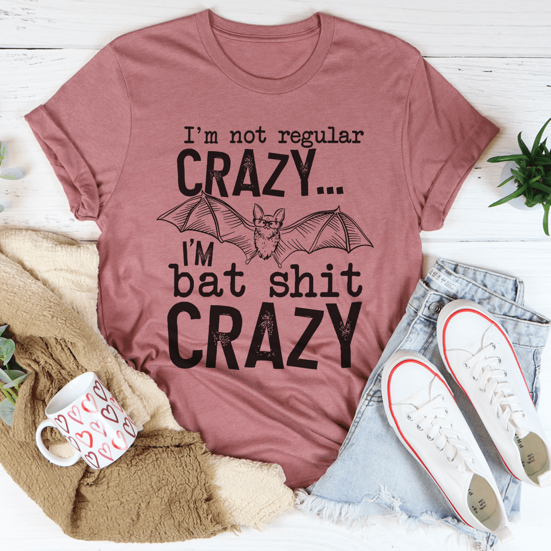 Mauve graphic T-shirt with bat graphic and 'Crazy' slogan text