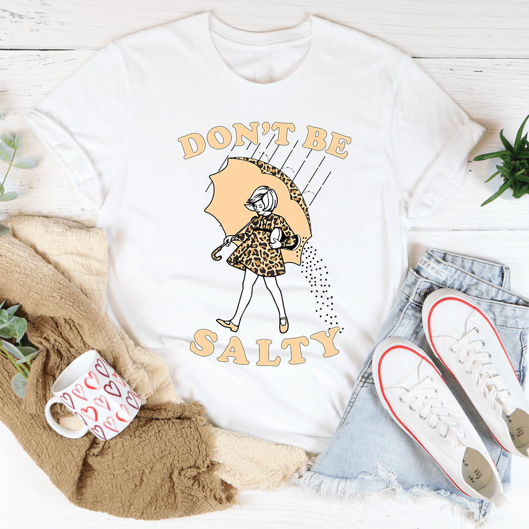 White V-neck T-shirt with umbrella girl graphic and text 'DON'T BE SALTY'