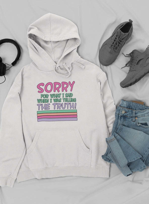 White hoodie with drawstring hood, front pocket, and colorful 'Sorry...' slogan graphic