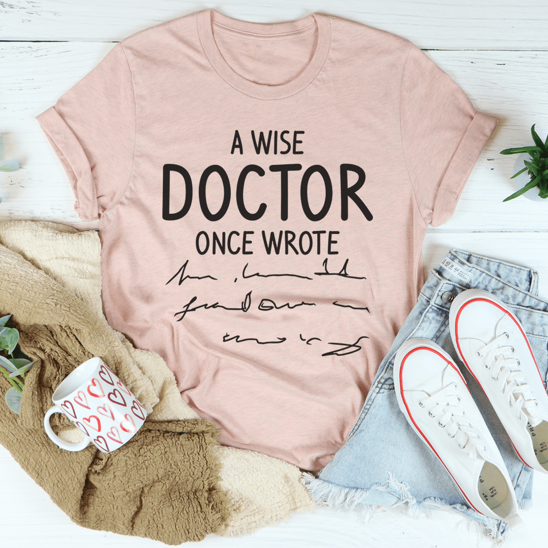 Mauve crewneck t-shirt with centered 'A WISE DOCTOR ONCE WROTE' print