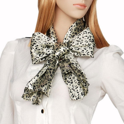 Leopard-print silk scarf knotted bow at neckline, ivory with dark spots