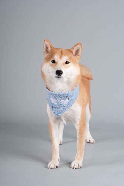 Dog bandana scarf in light blue with cyclops graphic, worn on tan dog (full view)