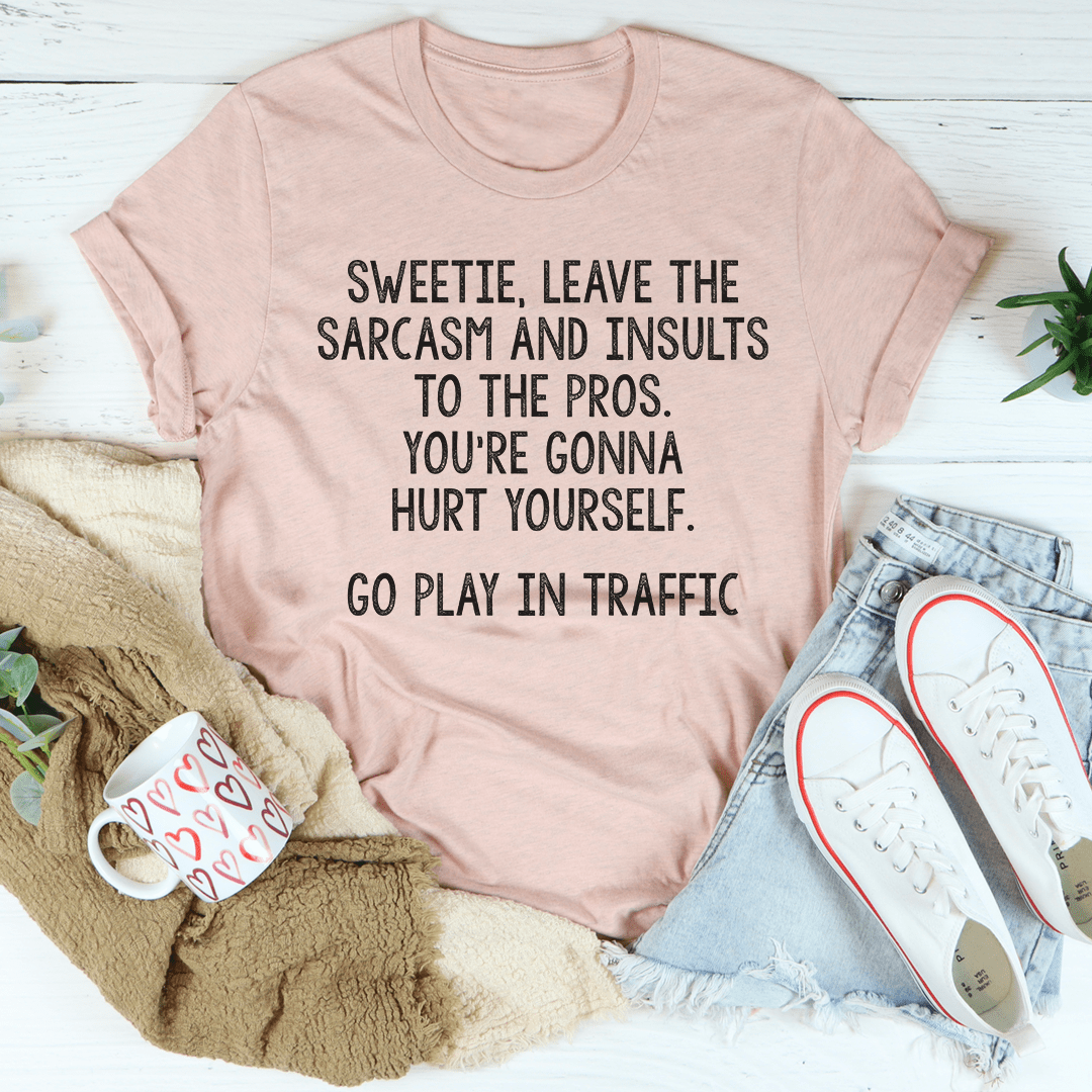 Dusty mauve crewneck T-shirt with bold black text graphic