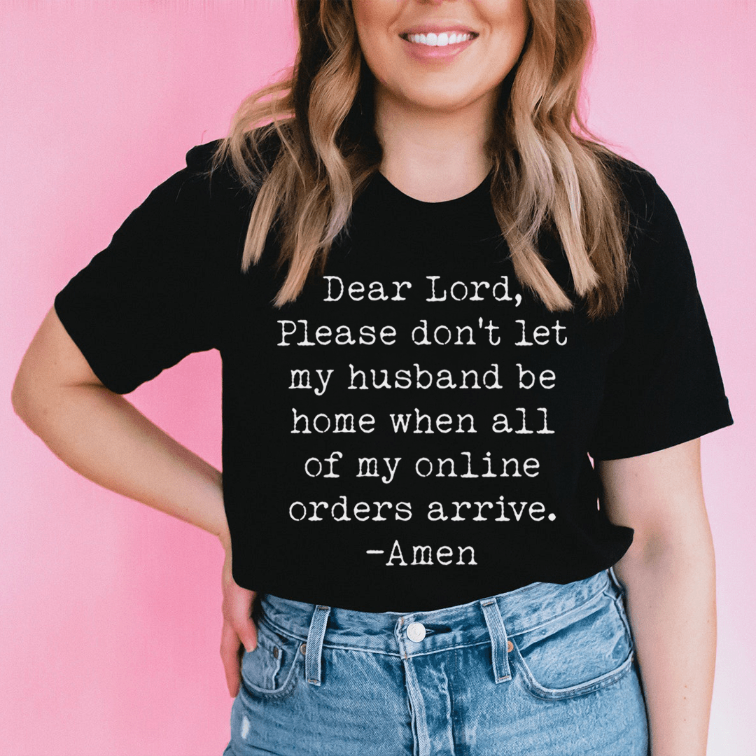 Black graphic T-shirt worn by model, 'Dear Lord' message centered on chest
