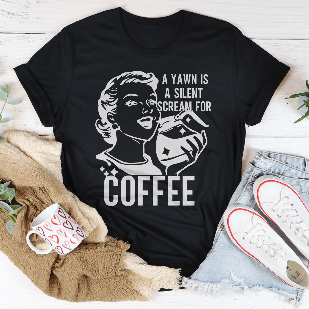 Black crew-neck t-shirt with face-and-coffee cup graphic and 'COFFEE' lettering