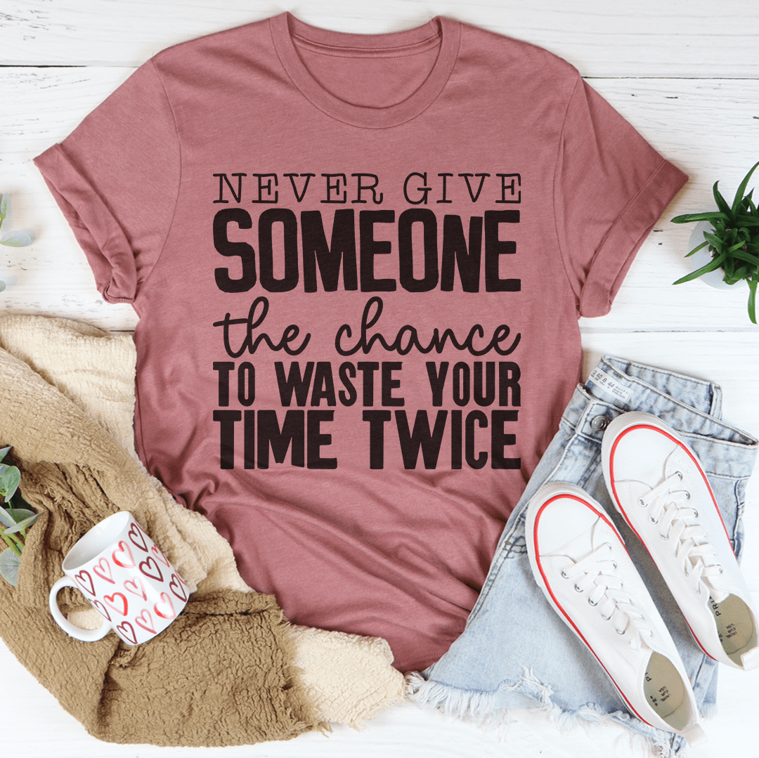 Rose mauve crewneck T-shirt featuring large 'SOMEONE' and 'Never give' text