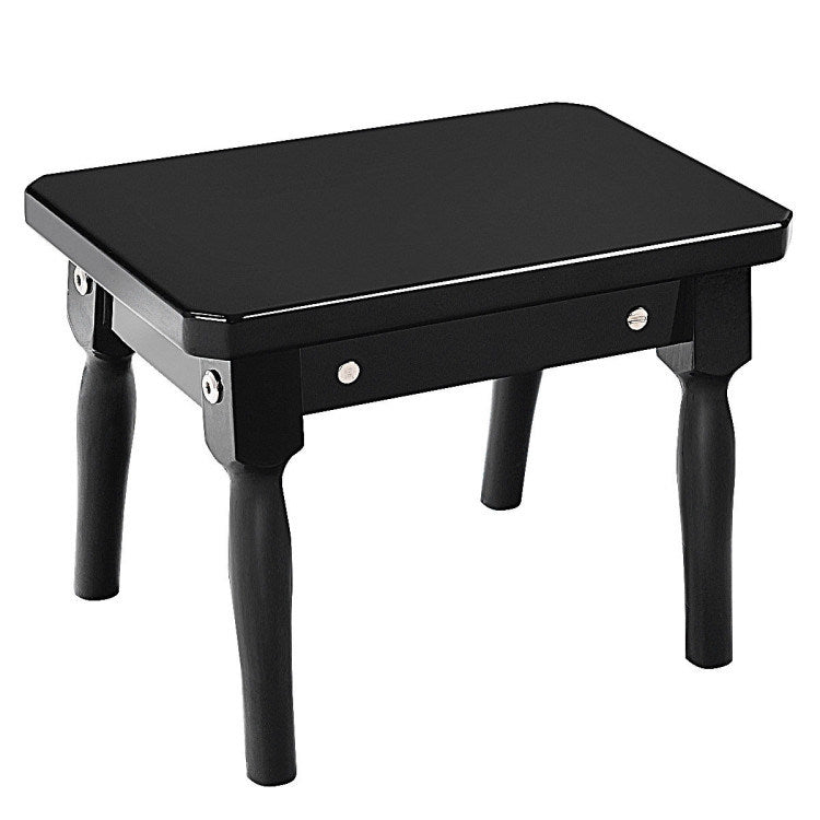 Black toy piano bench with padded top and four legs