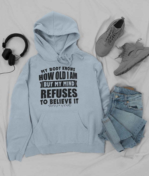 Powder blue hoodie with hood and front pocket, white slogan graphic