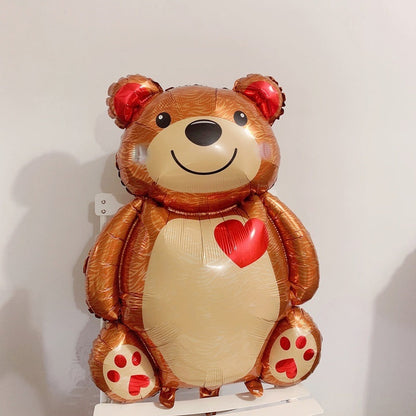 Brown bear foil balloon with red heart on white belly and red paw-print feet