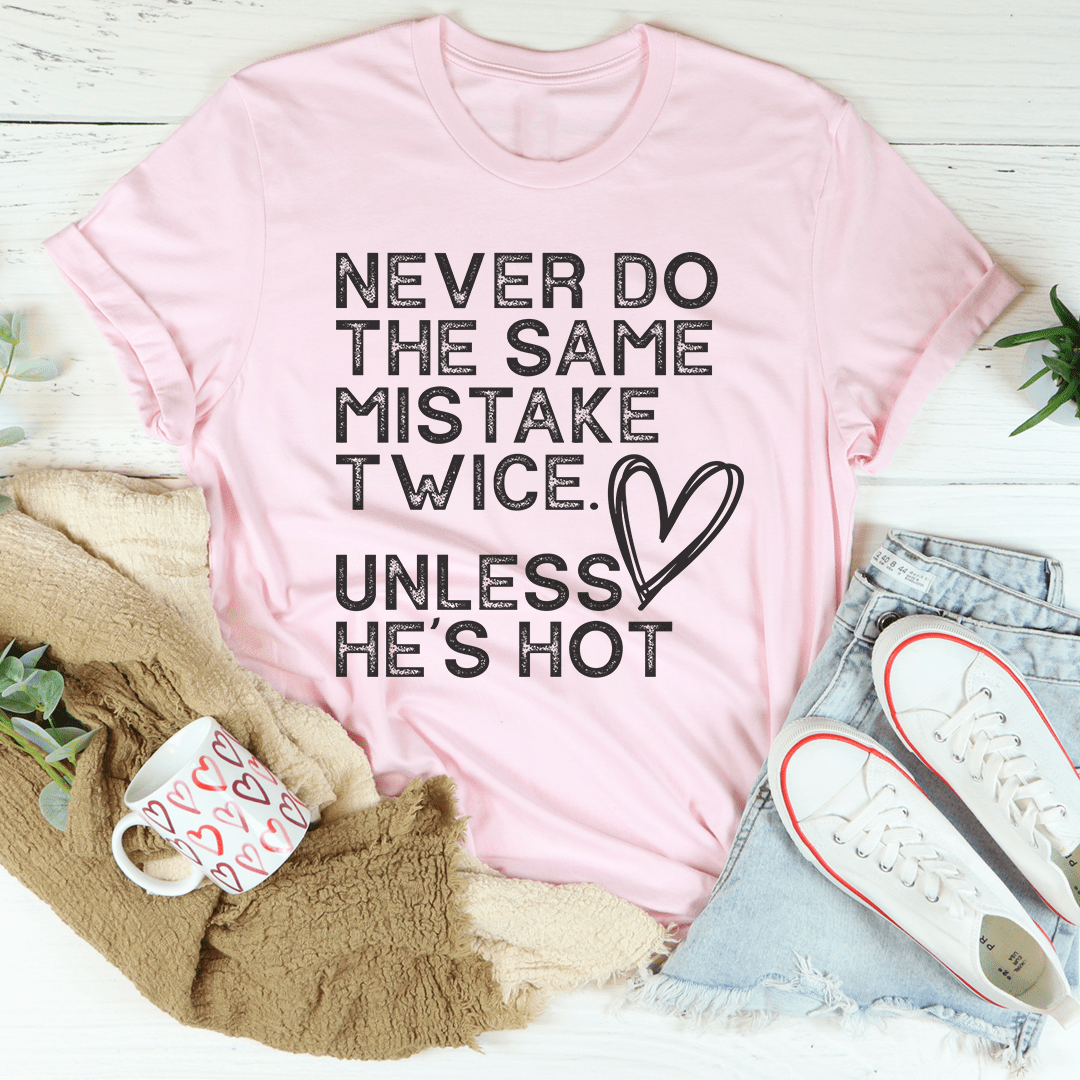 Pink crew-neck T-shirt with “Never do the same mistake twice” graphic