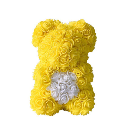 Yellow rose teddy bear with white heart-shaped accent on chest