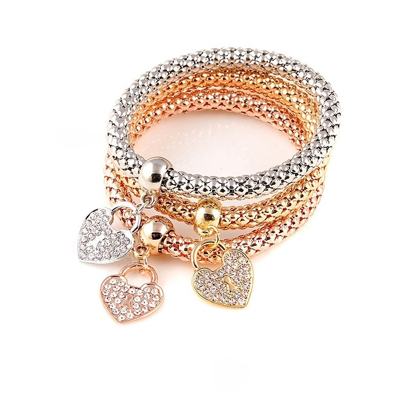 Multicolor rhinestone bracelet with four heart charms and mixed gold-silver links