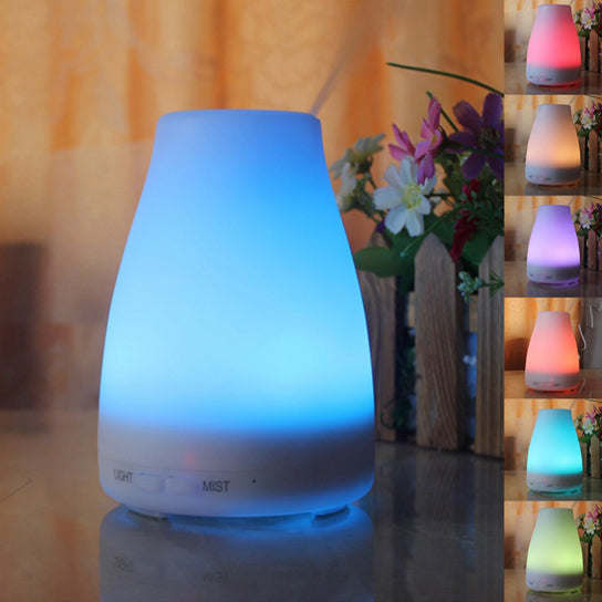 Aromatherapy-free humidifier with blue LED glow and mist output.